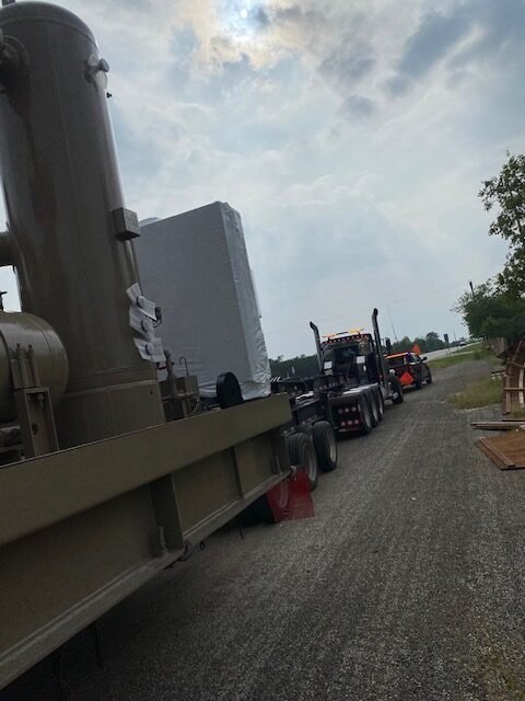 Oversize load operator receiving roadside assistance for two blown trailer tires in San Antonio TX.
